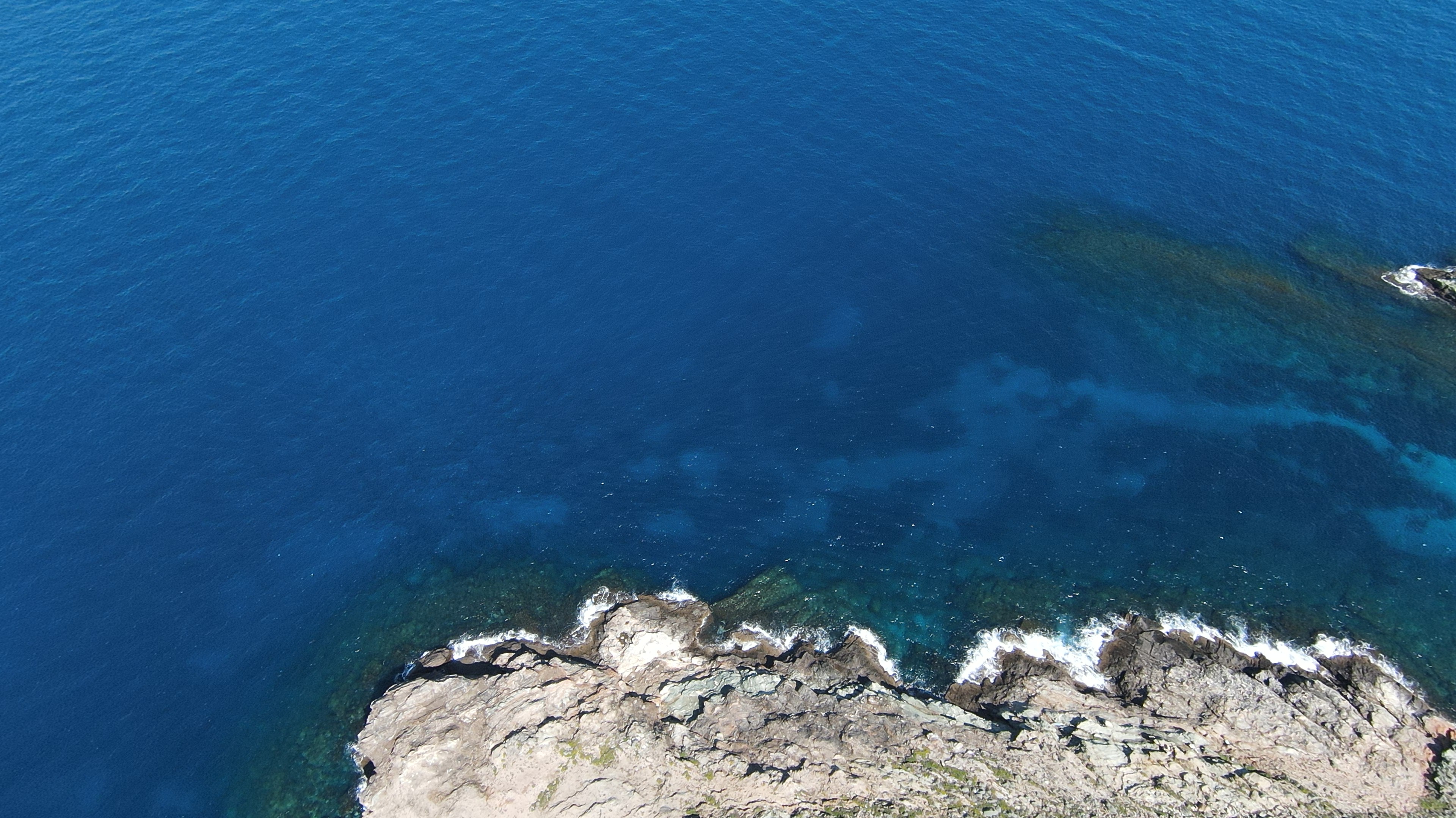 Crystal water below the cliffs